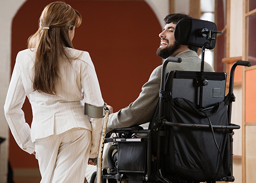 two disabled individuals walking together