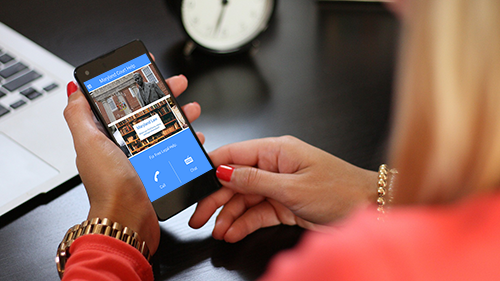 woman holding a phone with the MD Court App on screen