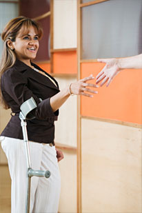 disabled woman shaking someones hand