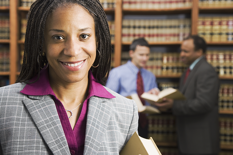 woman standing in library looking at camera