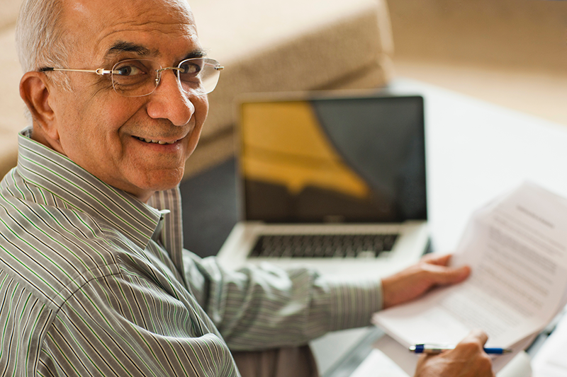 older gentleman sitting at computer