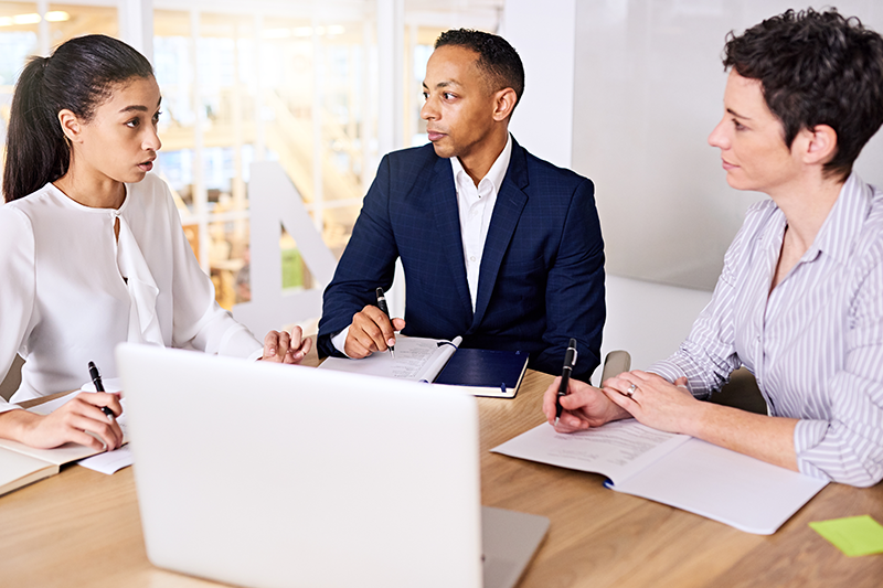 group of people talking at table