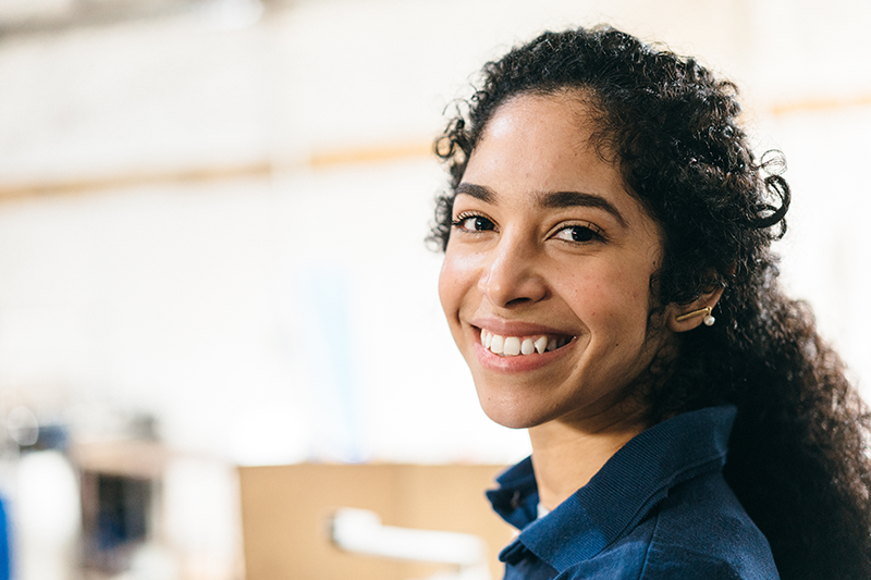 woman smiling and looking at camera